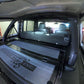 Image of a Jeep Wrangler JKU with a Diabolical, Inc. Slipstream security enclosure and foam deck pads with the Rail Rack accessory mount installed.