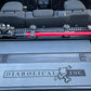 Image of a Jeep Wrangler JKU with a Diabolical, Inc. Slipstream security enclosure and foam deck pads with the Rail Rack accessory mount installed with a HiLift Jack.